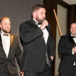 A group of people now has a microphone