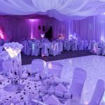 A very white looking event with a dance floor