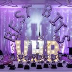 Best bits written in balloons at some kind of award ceremony with trophies on a table in front